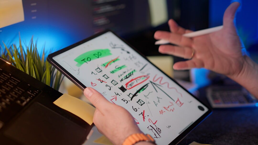 Consultants analyzing business growth charts on a tablet